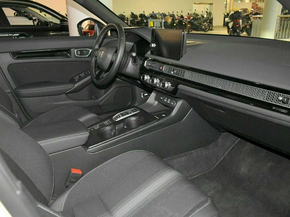 Honda Civic e: HEV Sport. .. Sport