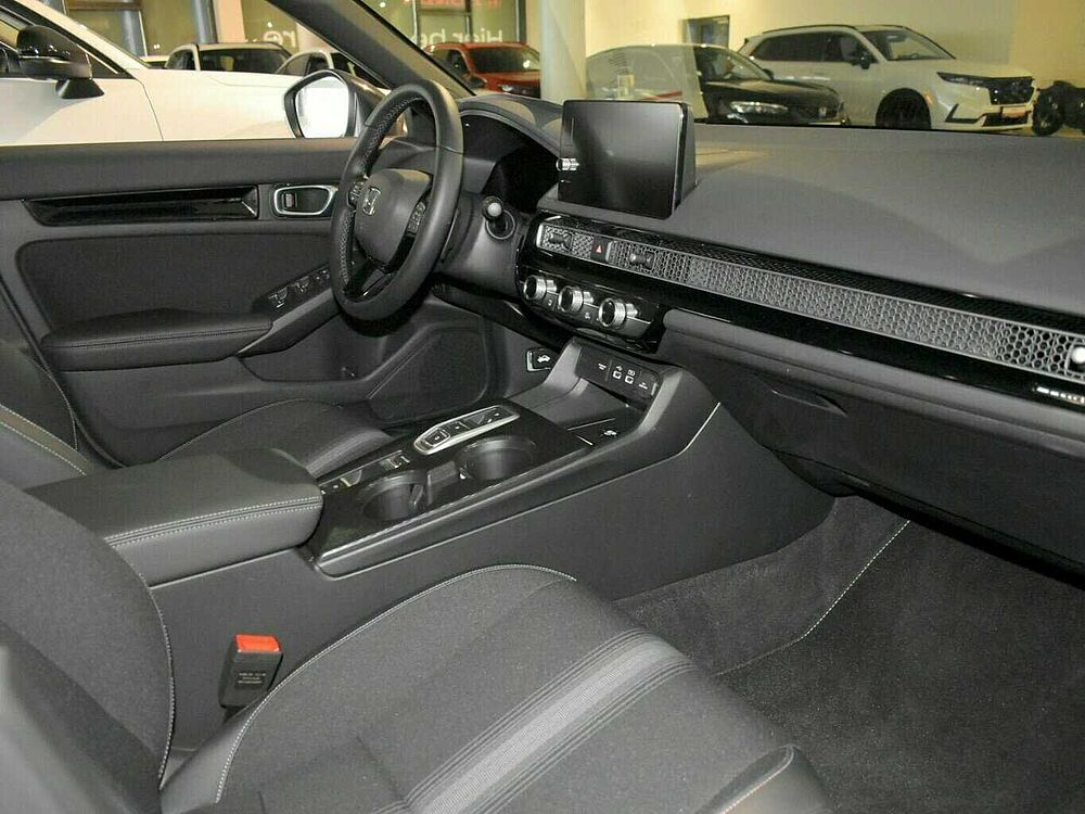 Honda Civic e: HEV Sport. .. Sport