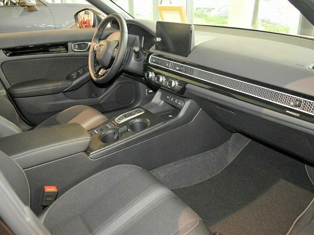 Honda Civic e: HEV Sport. .. Sport